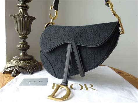 saddle dior oblique皮夾價錢|The Ultimate Bag Guide: Dior Saddle Bag .